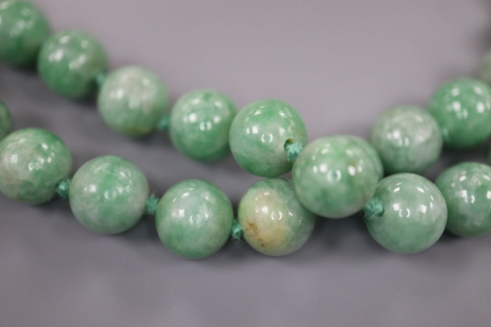 A single strand jade bead necklace, 81cm, gross 115 grams.